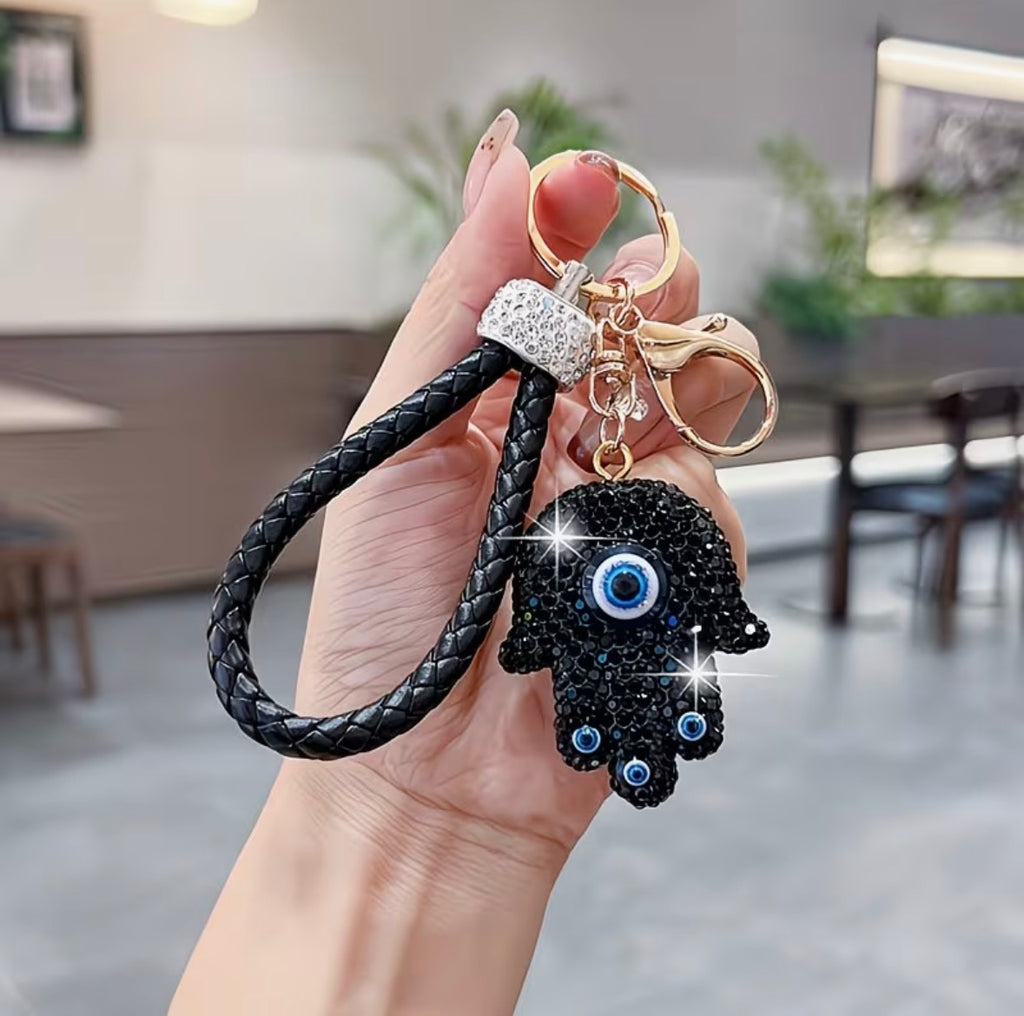 WARMINGO DE Evil Eye Hamsa Hand Keychain | Rhinestone Lucky Charm Key Ring with Braided Leather Strap | Women's Day Gift | Protection Amulet Accessory | Bag Charm Hanging
